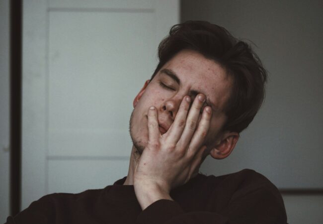 man wearing black crew-neck top